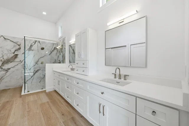 a bathroom with a sink toilet and shower