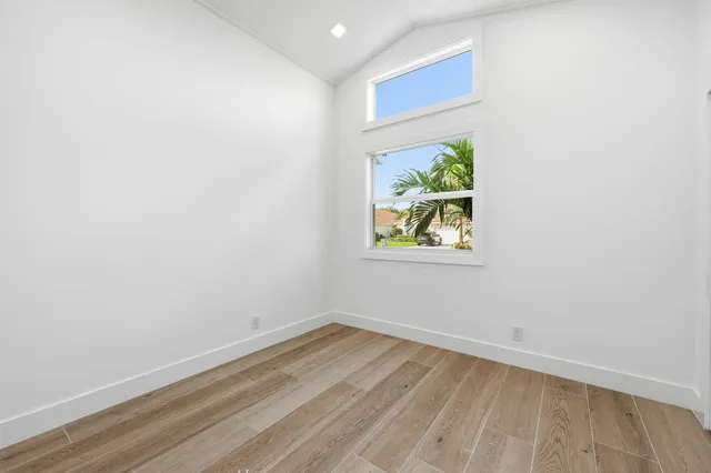 a bathroom with double vanity sink and a mirror