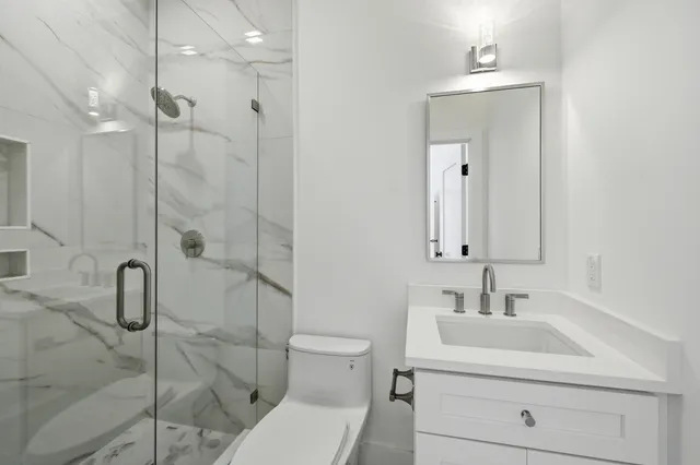 a bathroom with a sink double vanity and a mirror