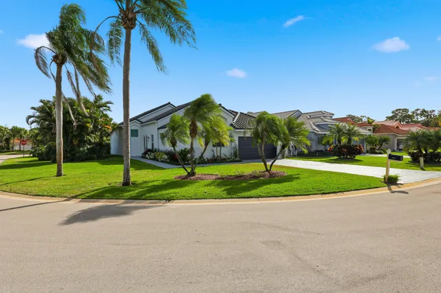 a view of a house with garden and a yard