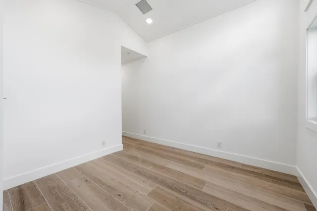 a bathroom with a shower sink and mirror