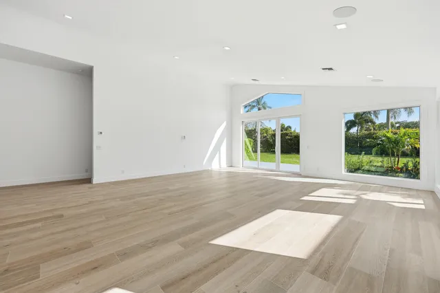 a view of kitchen with stainless steel appliances cabinets a sink and a refrigerator
