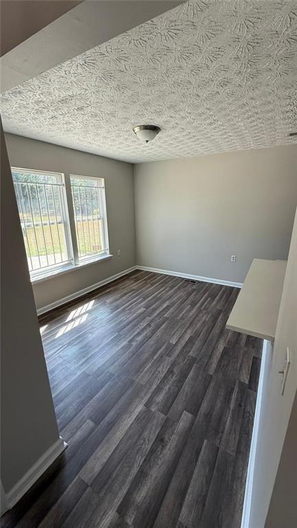 73 Polar Rock Road Southwest Atlanta, GA 30315 - Photo 13 of 16 wooden floor in an empty room with a window