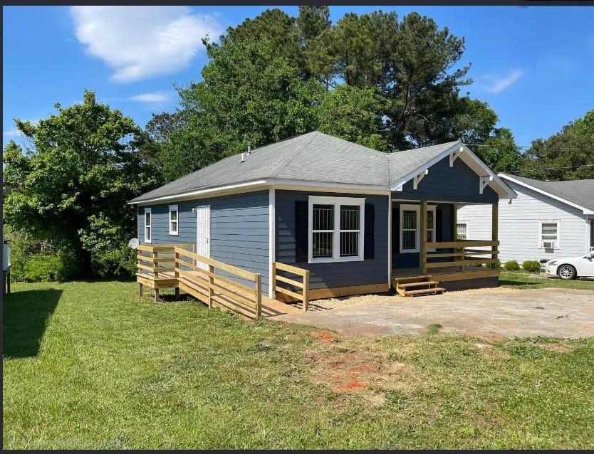 73 Polar Rock Road Southwest Atlanta, GA 30315 - Photo 2 of 16 a front view of a house with a yard and trees