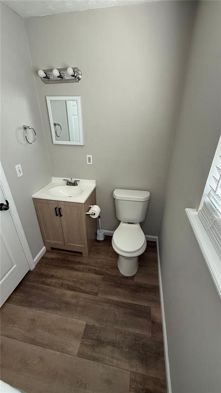 73 Polar Rock Road Southwest Atlanta, GA 30315 - Photo 10 of 16 a bathroom with a toilet sink and mirror