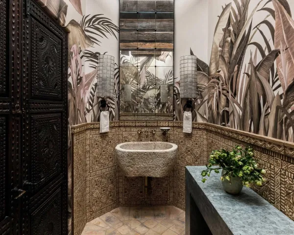 a bedroom with a bed couch and a window