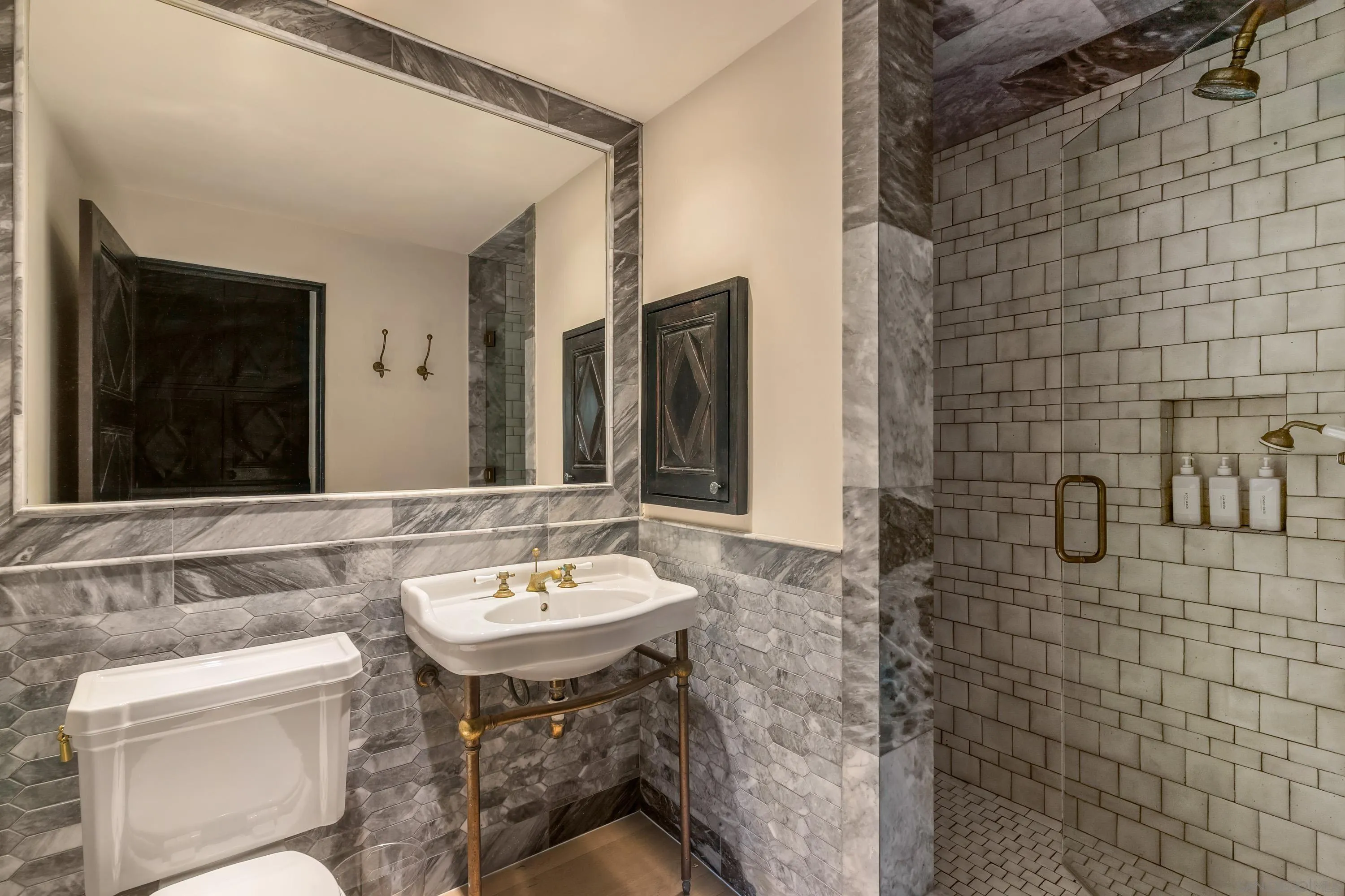 17116 Paseo Hermosa Rancho Santa Fe, CA 92067 - Photo 19 of 59 a bathroom with a sink and a mirror