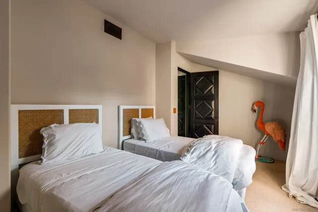 a hallway with table and chairs