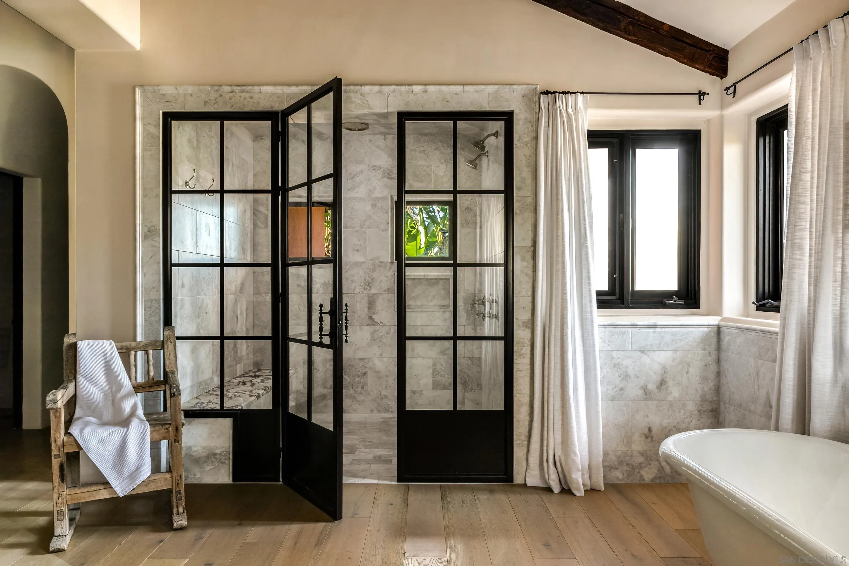 17116 Paseo Hermosa Rancho Santa Fe, CA 92067 - Photo 24 of 59 a bathroom with a toilet sink and a window