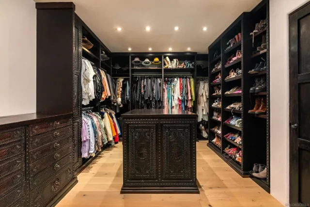 a bedroom with furniture and a lamp