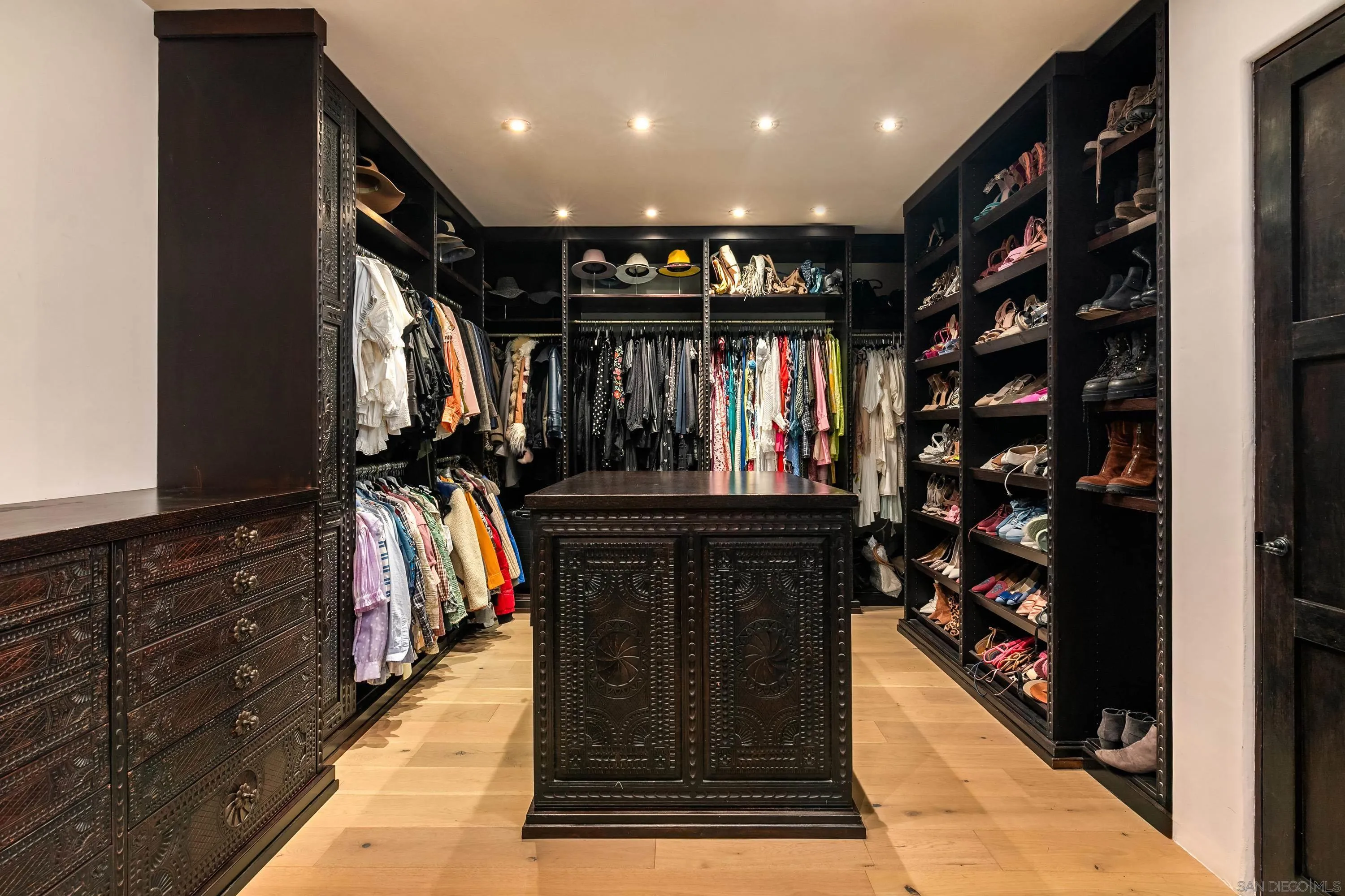 17116 Paseo Hermosa Rancho Santa Fe, CA 92067 - Photo 26 of 59 a view of walk in closet with clothes and shoes