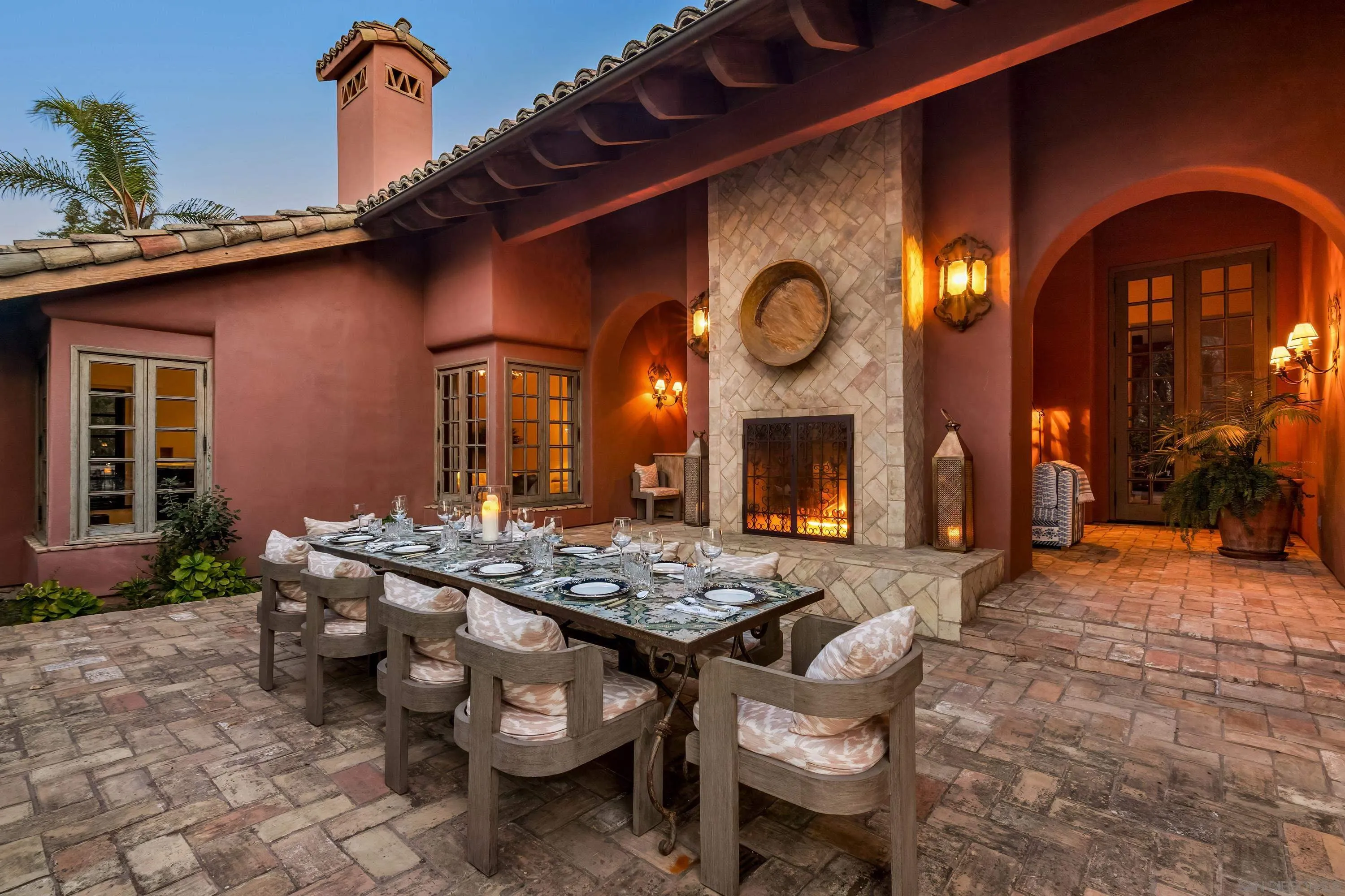 17116 Paseo Hermosa Rancho Santa Fe, CA 92067 - Photo 27 of 59 a view of a dinning room with patio furniture and potted plants