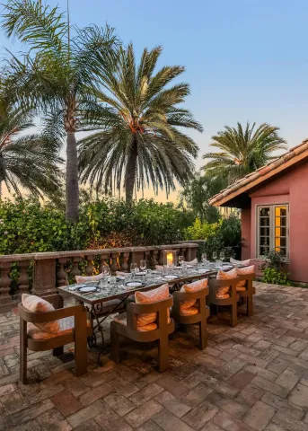 a front view of a house with outdoor seating