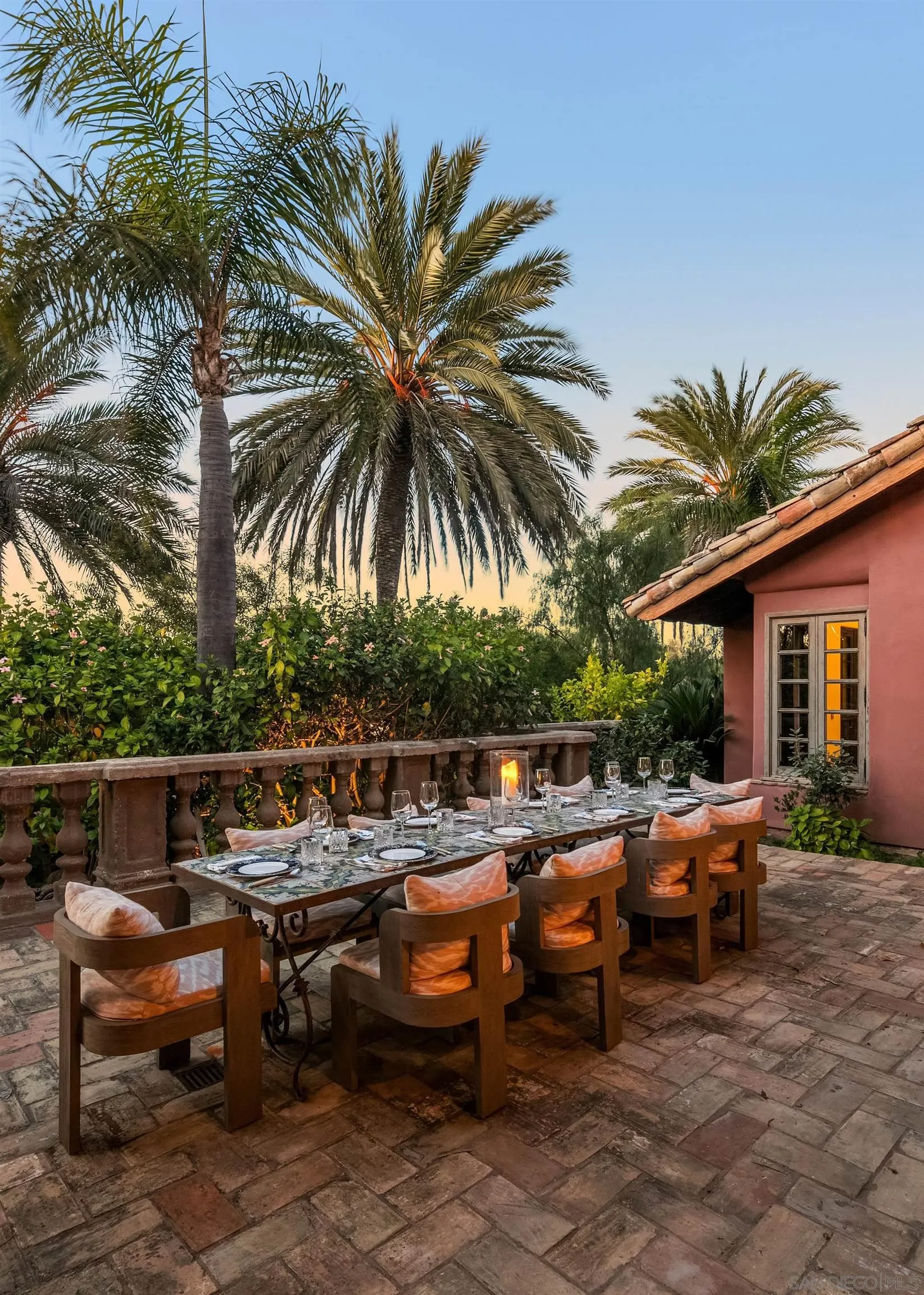 17116 Paseo Hermosa Rancho Santa Fe, CA 92067 - Photo 28 of 59 a view of a patio with table and chairs potted plants and palm tree