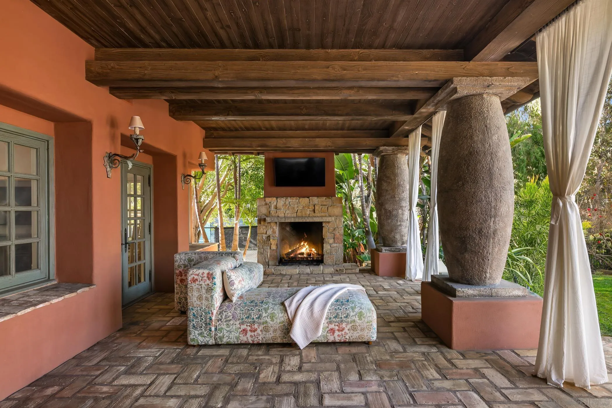 17116 Paseo Hermosa Rancho Santa Fe, CA 92067 - Photo 31 of 59 a front view of a house with outdoor seating