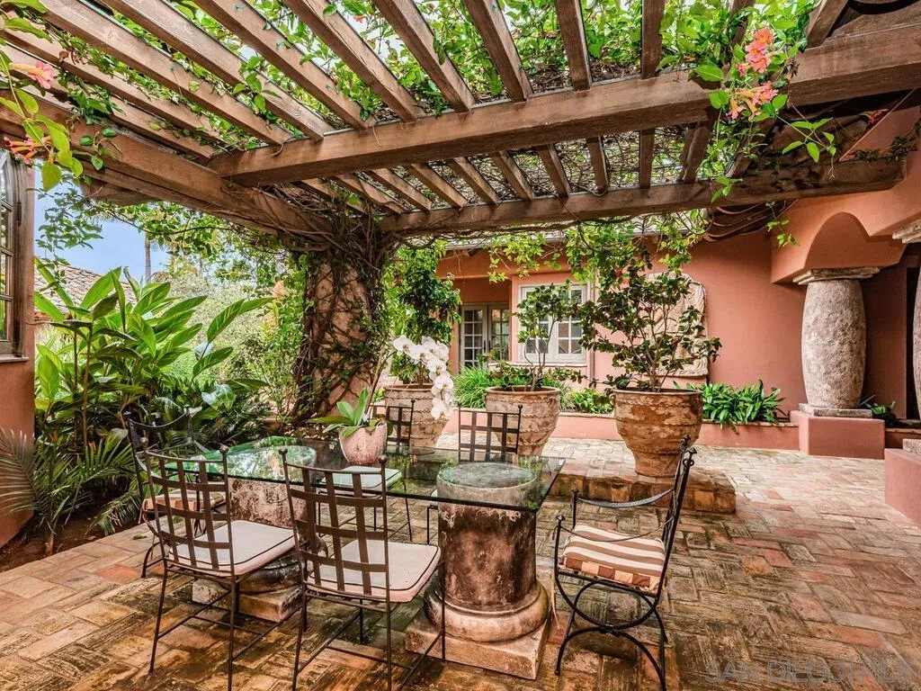 17116 Paseo Hermosa Rancho Santa Fe, CA 92067 - Photo 32 of 59 a view of a chairs and table in the patio