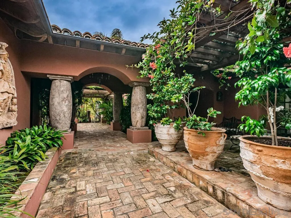 17116 Paseo Hermosa Rancho Santa Fe, CA 92067 - Photo 34 of 59 a view of house with patio entertaining space and garden