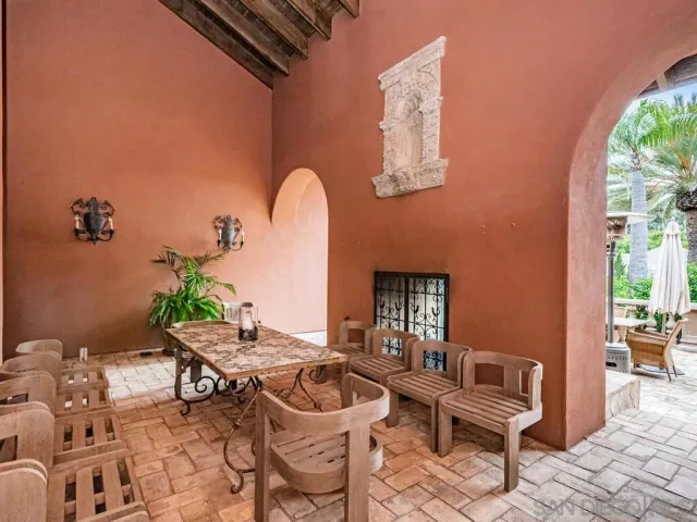 a view of a dinning table and chairs in patio