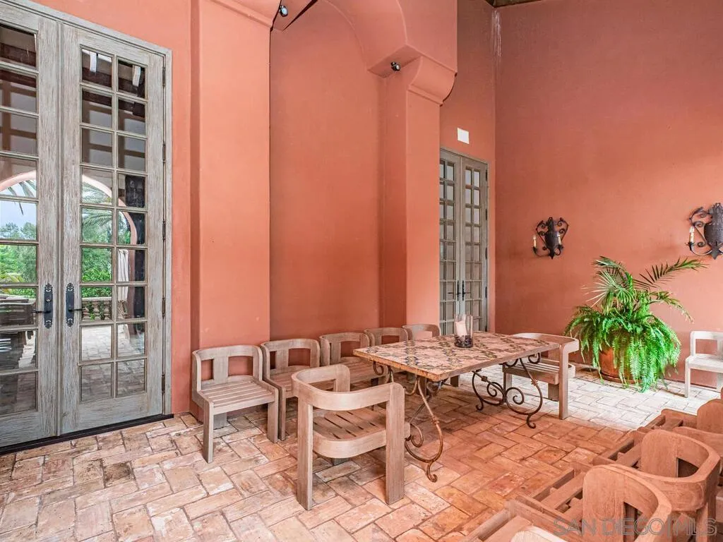 17116 Paseo Hermosa Rancho Santa Fe, CA 92067 - Photo 38 of 59 a view of a dinning table and chairs in patio