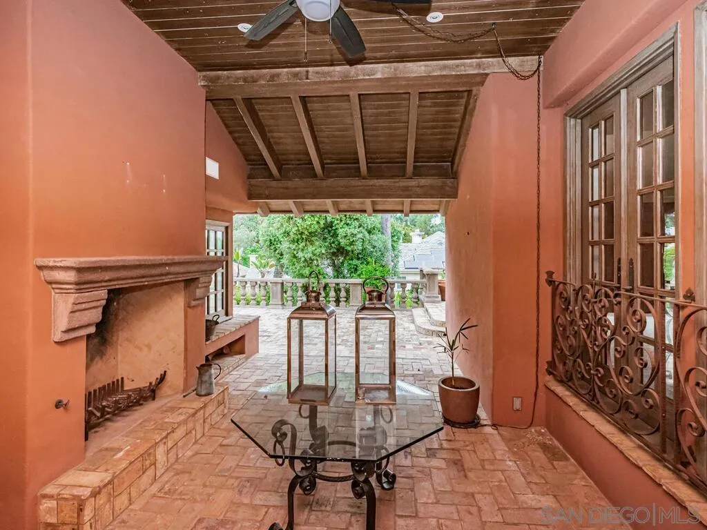 17116 Paseo Hermosa Rancho Santa Fe, CA 92067 - Photo 44 of 59 a porch area with table and chairs
