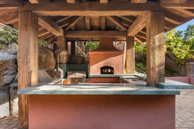 a view of living room with furniture and a fireplace