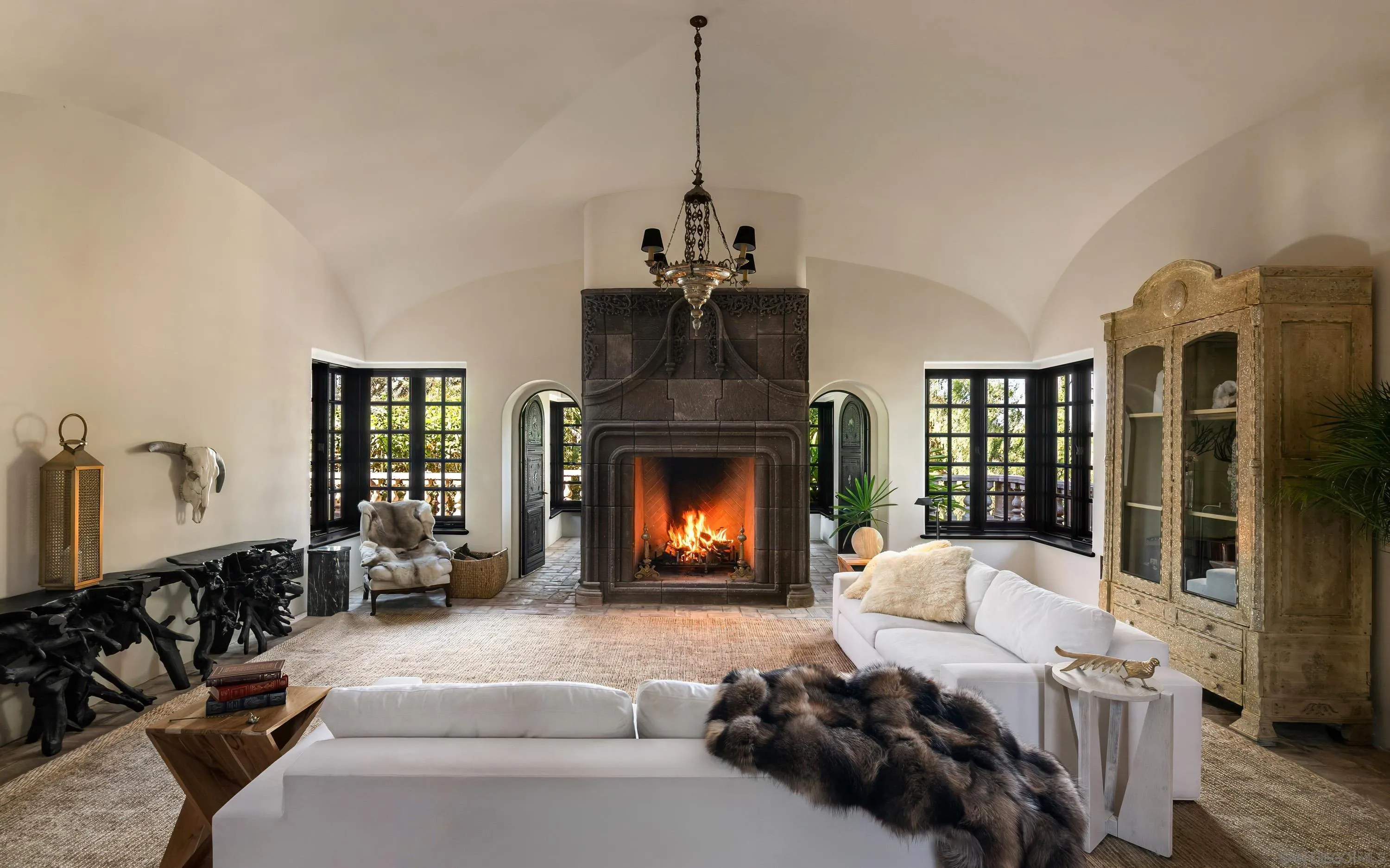 17116 Paseo Hermosa Rancho Santa Fe, CA 92067 - Photo 51 of 59 a living room with furniture and a fireplace