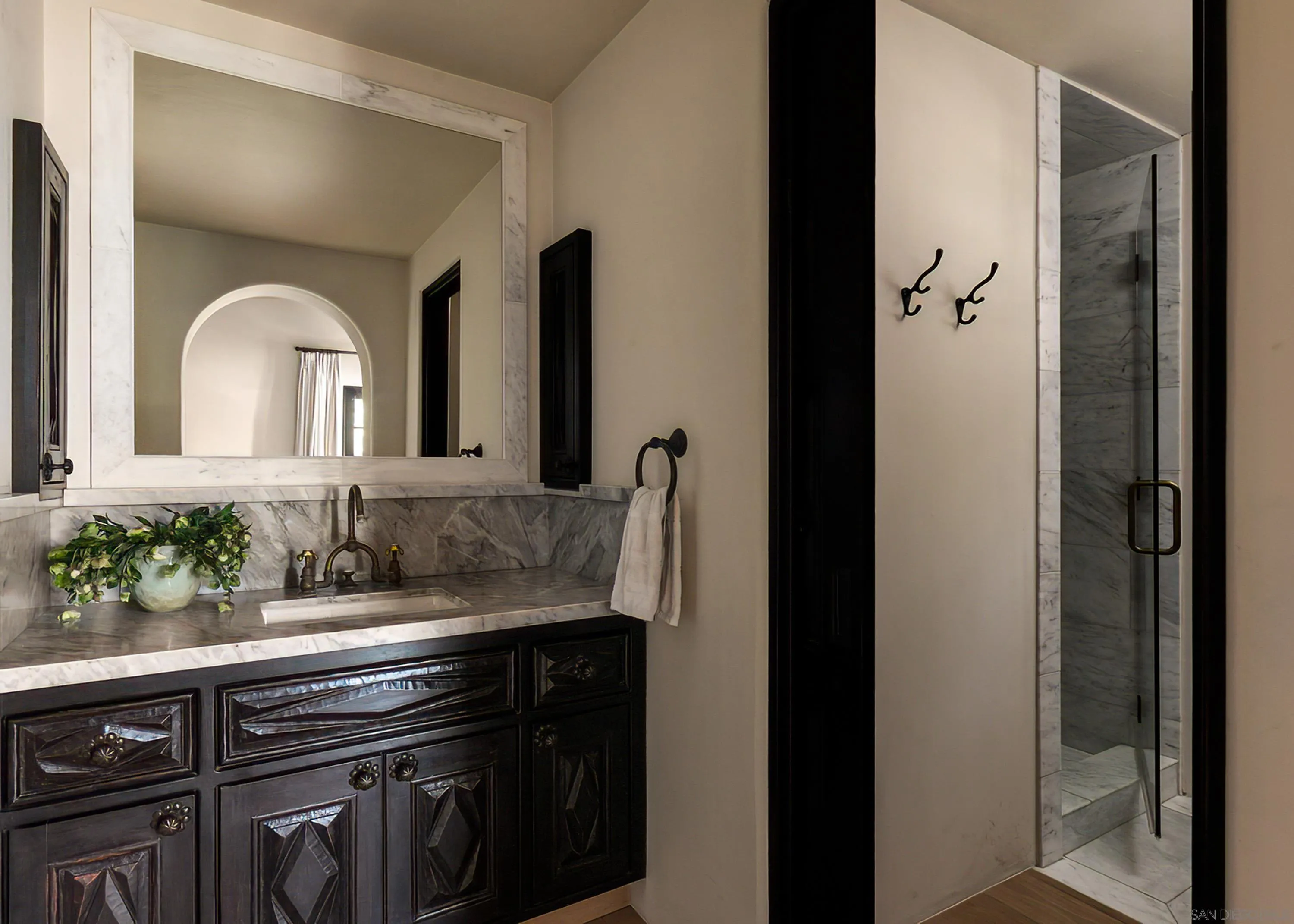 17116 Paseo Hermosa Rancho Santa Fe, CA 92067 - Photo 54 of 59 a bathroom with a sink and a mirror