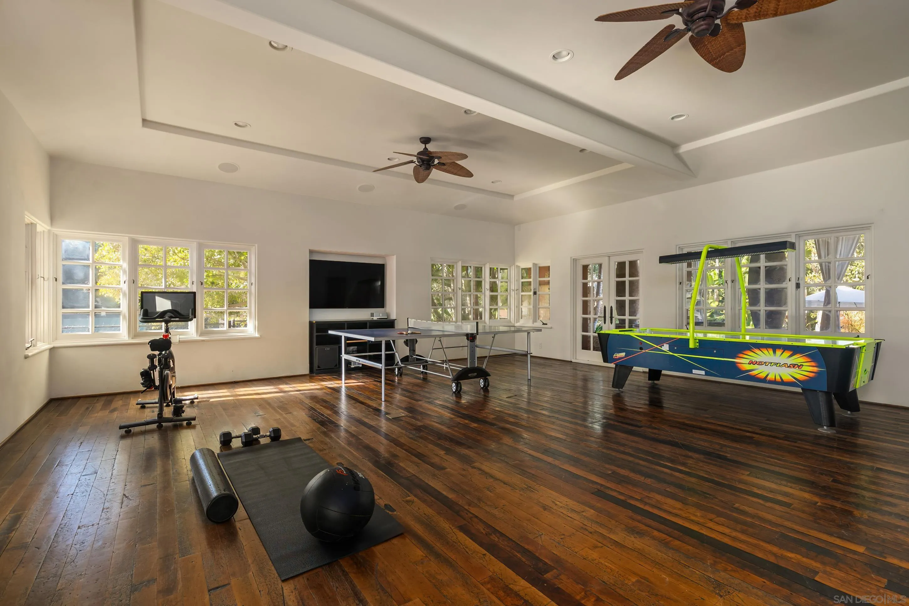 17116 Paseo Hermosa Rancho Santa Fe, CA 92067 - Photo 58 of 59 a living room with furniture a flat screen tv and a wooden floor