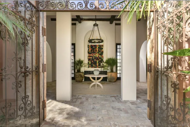 a living room with furniture potted plant and a window