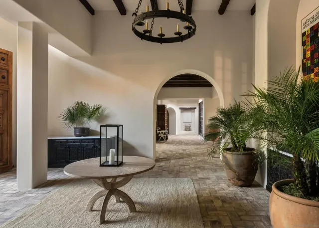 a living room with furniture and a potted plant