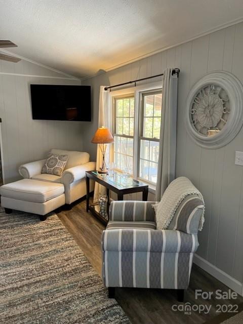 200 Golfwatch Road Canton, NC 28716 - Photo 3 of 38 a living room with furniture a large window and a flat screen tv