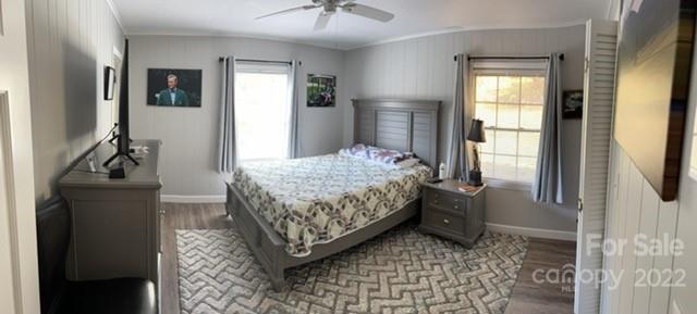 200 Golfwatch Road Canton, NC 28716 - Photo 4 of 38 a bedroom with a bed and a mirror on dresser