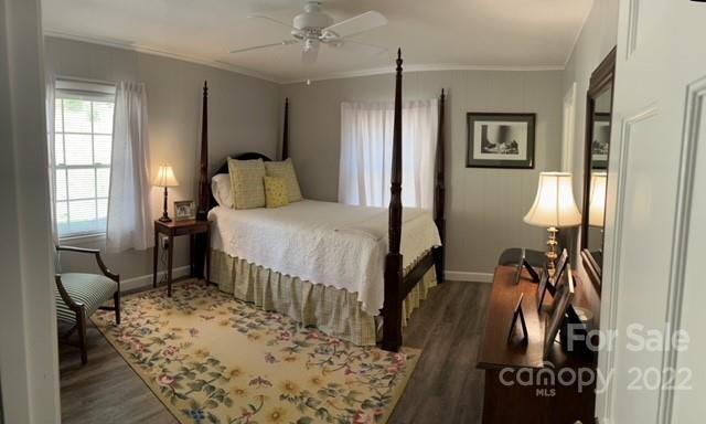 200 Golfwatch Road Canton, NC 28716 - Photo 6 of 38 a bedroom with a bed and wooden floor