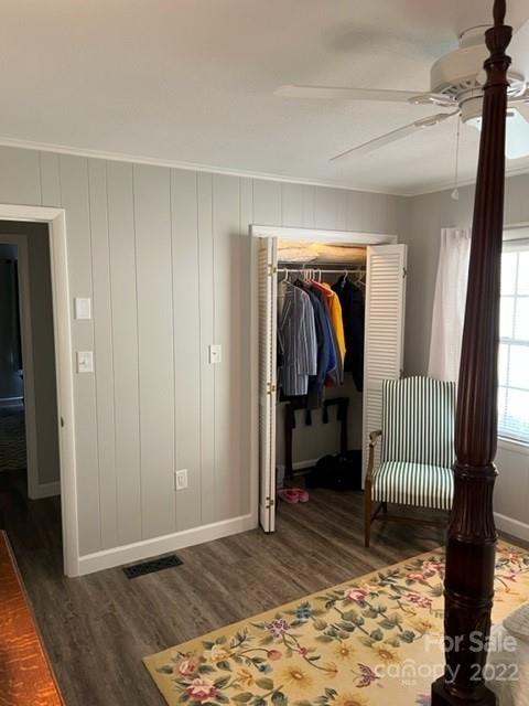 200 Golfwatch Road Canton, NC 28716 - Photo 7 of 38 a view of a bedroom with wooden floor and furniture