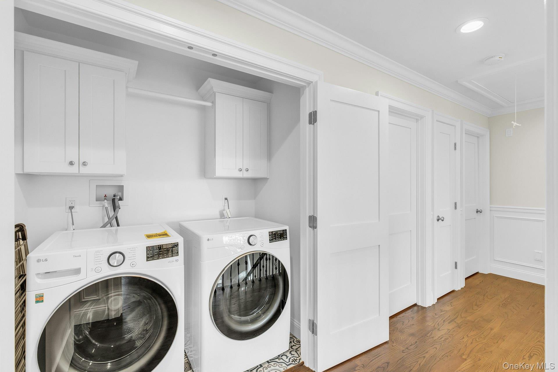9 Hickory Road Bayville, NY 11709 - Photo 18 of 30 Second floor laundry room with double door, custom cabinetry.