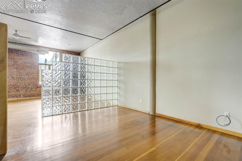 115 North Tejon Street, Unit B Colorado Springs, CO 80903 - Photo 24 of 43 a view of a livingroom with wooden floor