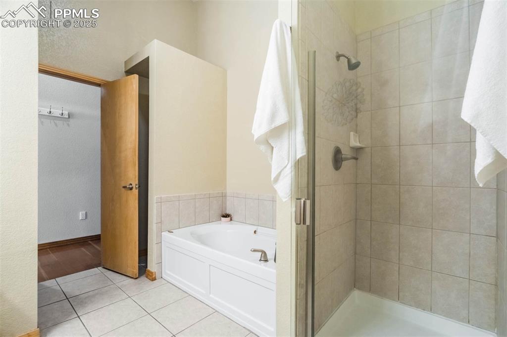 115 North Tejon Street, Unit B Colorado Springs, CO 80903 - Photo 30 of 43 a bathroom with a bathtub and a shower