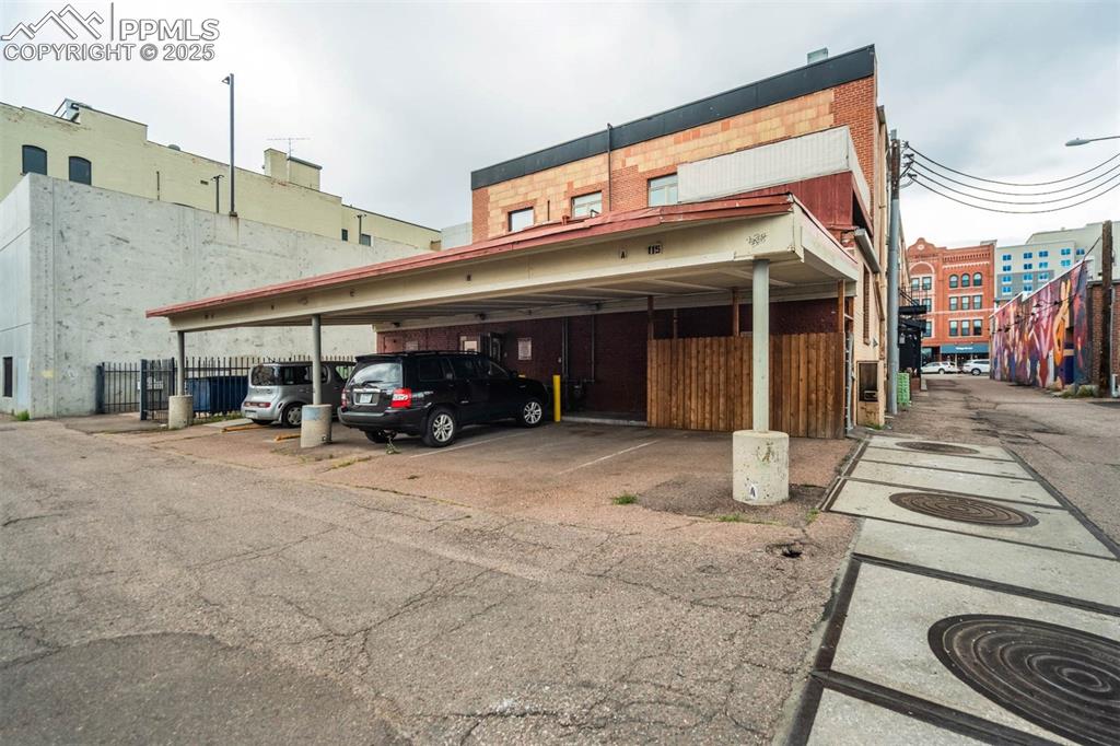115 North Tejon Street, Unit B Colorado Springs, CO 80903 - Photo 35 of 43 a view of a building with car parked