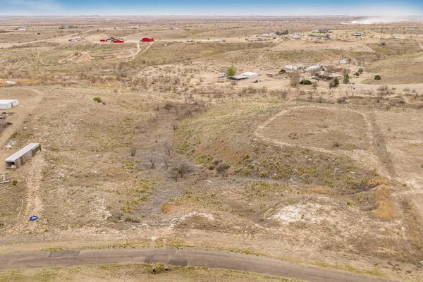 an aerial view of beach with wooden space