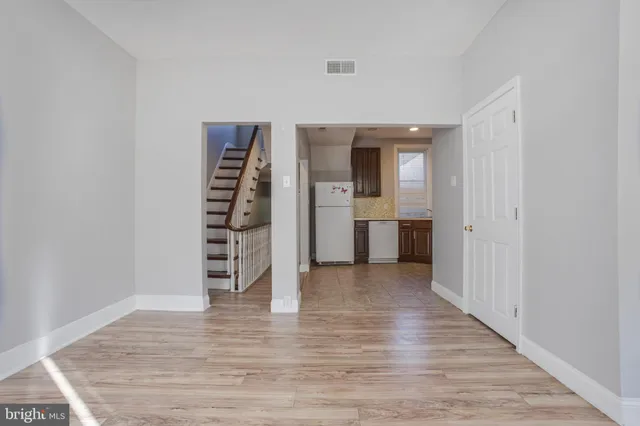 a kitchen with a stove sink and refrigerator