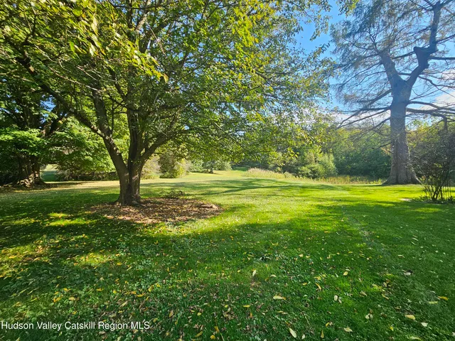 a view of outdoor space with deck and yard