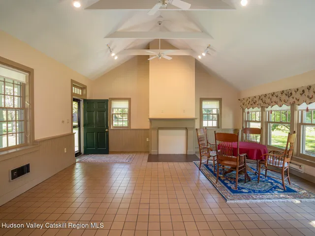 a view of a livingroom with furniture and windows