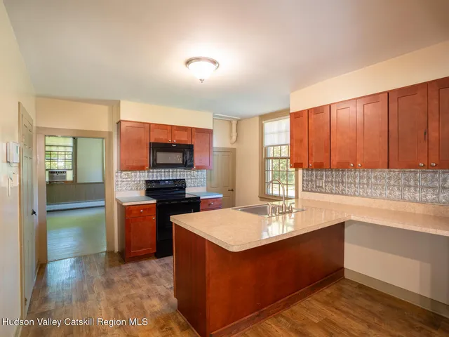 a kitchen with a sink and a microwave
