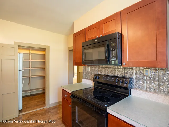 a kitchen with a stove and a microwave
