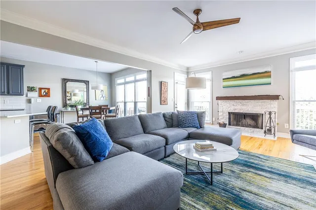 a living room with furniture fireplace and a table