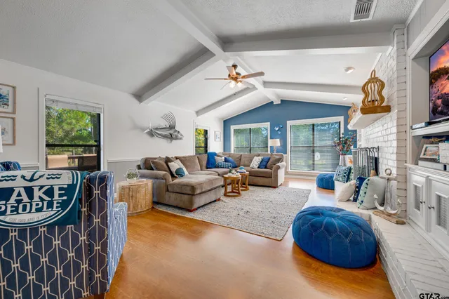 a living room with furniture and a fireplace