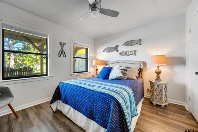 a view of a porch with furniture and a backyard