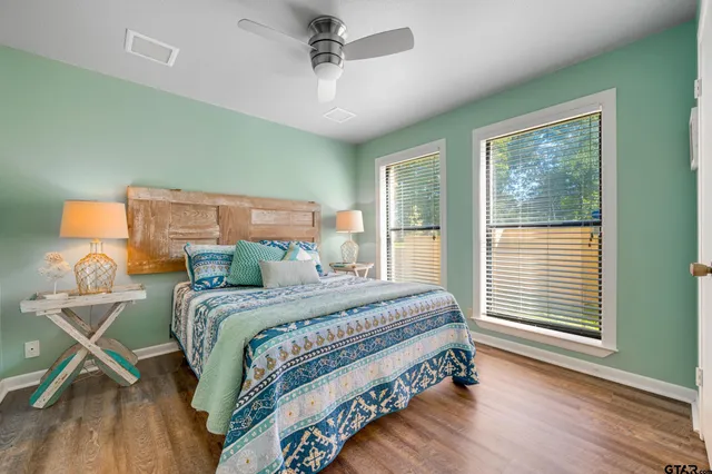 a view of backyard with swimming pool and outdoor seating