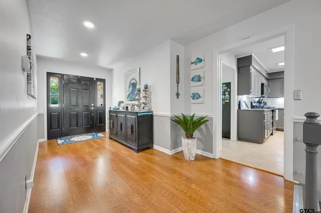 a kitchen with sink and refrigerator