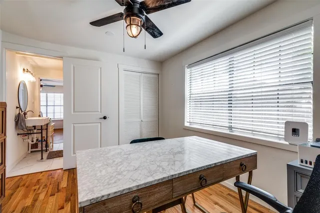 a view of a room with furniture and windows